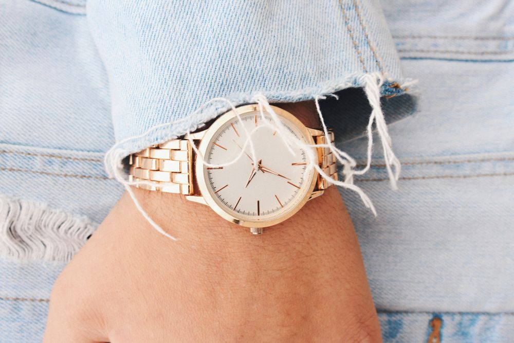 Image of a woman wearing a steel bracelet watch