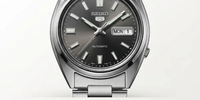 Seiko 5 SNXS79 automatic dress watch with dark rhodium sunburst dial on stainless steel bracelet