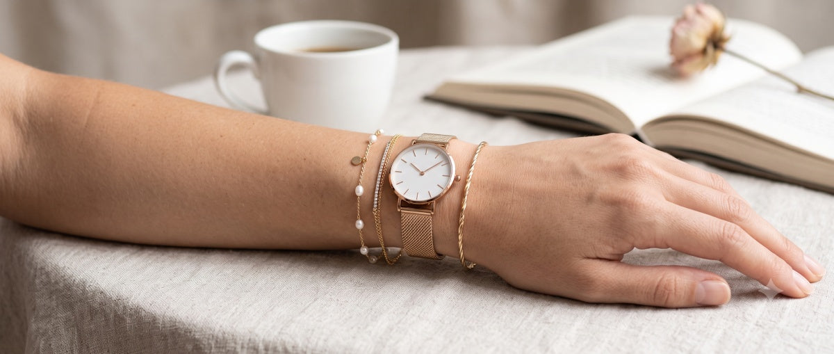 Image of wearing a watch with delicate bracelets